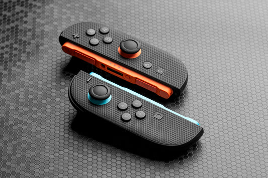 Two Joycons with "mini hex" touchprotect skins installed