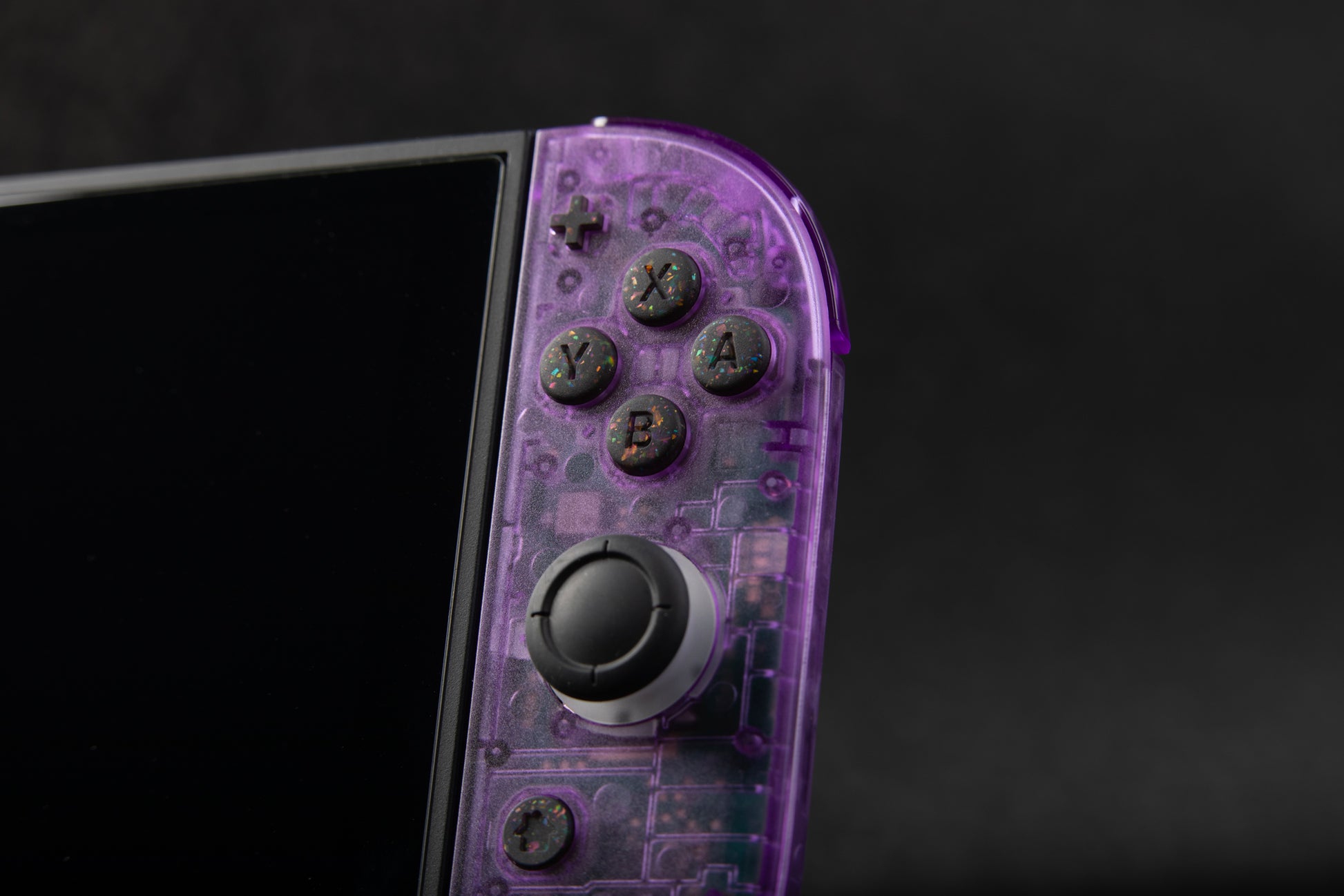 clear purple joycons installed in switch 2 with black rainbow confetti buttons installed