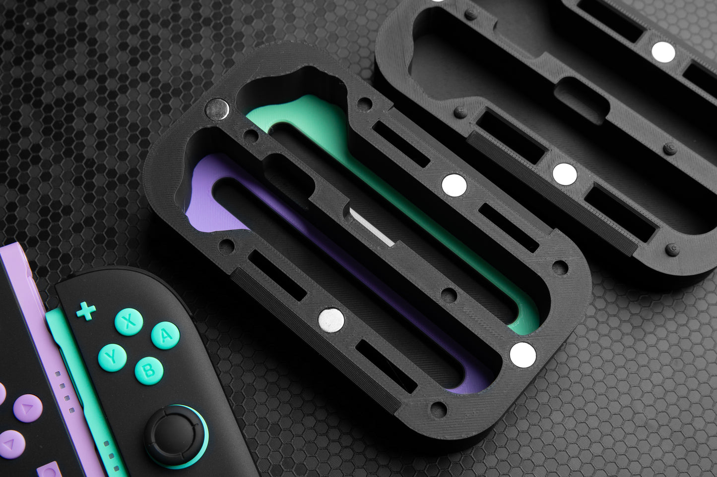 Black protective case for a gaming controller on a dark textured background
